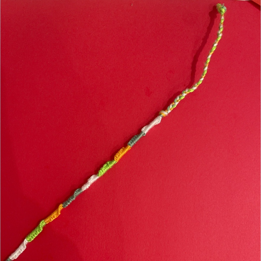 CHINESE STAIRCASE THREAD FRIENDSHIP BRACELET- green, orange, and white